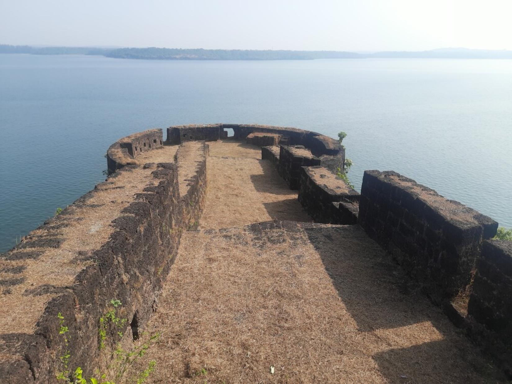Robust bastions and ramparts of the Vijaydurg fort.