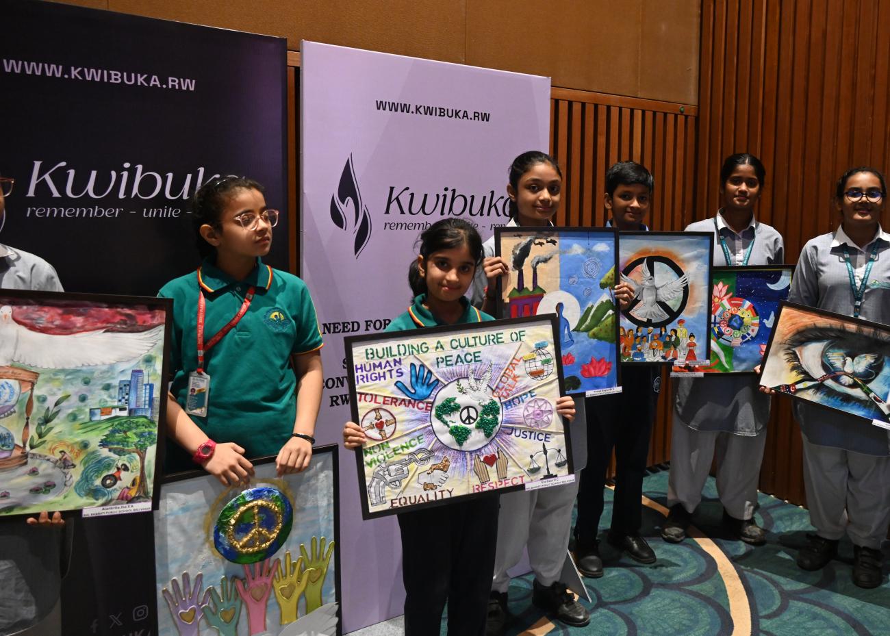 School children pay tribute to the lives lose in the 1994 genocide against the Tutsi in Rwanda at a commemorative event in New Delhi. 