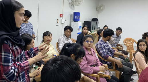 A young woman gestures while speaking as a group of refugees and asylum seeker youth look on during an interaction with United Nations in India Resident Coordinator Shombi Sharp at the UNHCR registration facility in New Delhi.  #WithRefugees #DignityForAll #YouthEmpowerment #GlobalGoals 